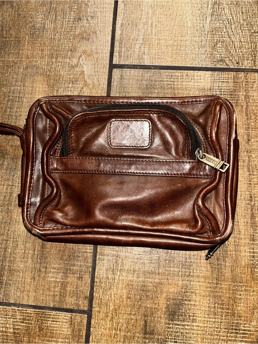TUMI brown leather travel bag